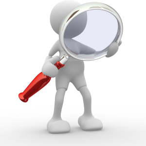 Little white animated humanoid holding a giant magnifying glass