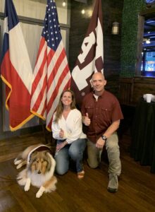 Photo of Director Fleming and wife, Amanda, with Reveille